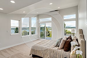 Restful bedroom interior with master bed placed under a sloped ceiling