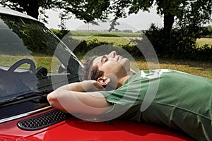 Resting on a car photo