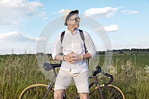 Resting Contented Cyclist on a Countryside Road