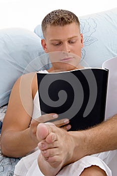 Resting male reading report