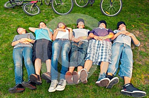 Resting teenagers after bicycle ride