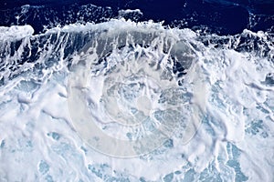 Restless foamy blue sea water texture photo