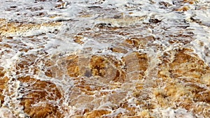 Restless water in the river during a flood