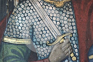 Restoration: close up of a painting final retouch