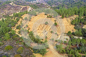 Restoration of former open pit Evloimeni copper mine, Cyprus. Forest restored over old waste dumps photo