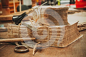 Restoration laboratory. Ancient books surrounded by tools and equipment