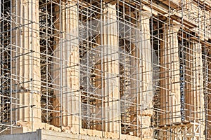 Restoration of Parthenon temple marble columns at the Acropolis, Athens, Greece, surrounded by scaffolding - close up, details