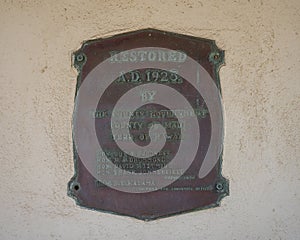Restoration plaque, Old Lahaina Courthouse in Lahaina Banyan Court Park on the island of Maui in the state of Hawaii.