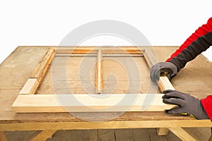 Close up of a carpenter repairing sash window frame photo