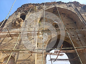 restoration work in progress of the ruins of Mohar Garh fort situated on a hill