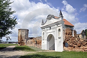 Restored entrance gate and remains of the walls of the Carthusian monastery of 1648-1666 in the town of Bereza, Belarus