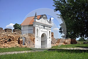 Restored entrance gate and remains of the walls of the Carthusian monastery of 1648-1666 in the town of Bereza, Belarus. photo