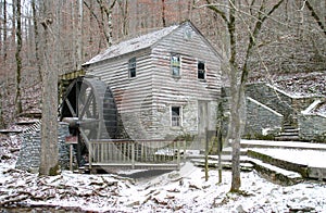 Old Gristmill in light snow photo