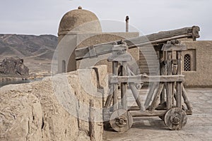 Restored medival siege weapon on the arabic fort wall.