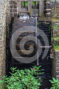 Restored Mill Wheel of an old Water Mill photo
