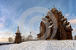 Restored orthodox wooden Twenty-five-headed Church of the Intercession of the Blessed Virgin Pokrovskaya at sunny winter day. St.