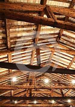 Restored roof with wooden beams and the lamps photo