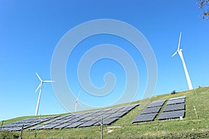 Restored sanitary landfill cell with photovoltaic cells and wind turbine