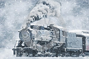 A Restored Steam Engine Steamed Up in a Snow Storm With Icicles