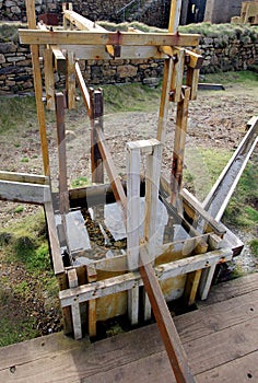 Restored wooden jigging machine for sorting tin ore, at an old C photo