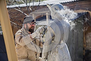 Restorer is engaged in the restoration of the statue