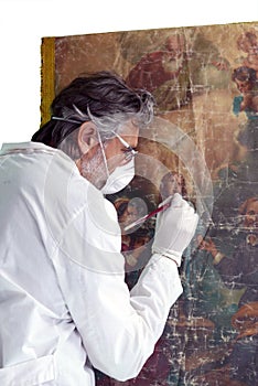 Restorer with  painting  artwork