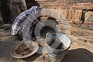 Restorative woman working, Bagan photo