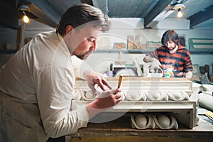 Restorers working with gypsum models