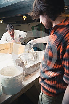 Restorers working with gypsum models