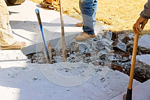 Restoring pavement after destroyed concrete sidewalk demolition repair