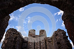 Restormel Castle ruins beneath archway