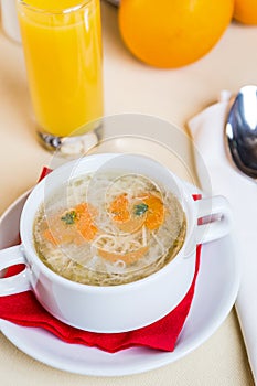 Restourant serving dish for child`s menu - noodles soup with face