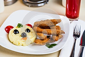 Restourant serving dish for child`s menu - potato puree, stick w