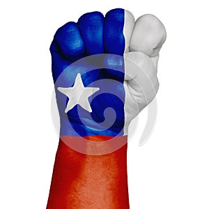 Restrained image of a fist painted in the colors of the flag of Chile. Image on a white background