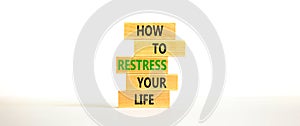 Restress your life symbol. Concept words How to restress your life on wooden blocks. Beautiful white table white background. Copy