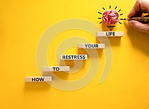 Restress your life symbol. Concept words How to restress your life on wooden blocks. Doctor hand. Beautiful yellow background.