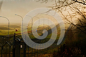 Restricted area. Barbed wire fence at the state border