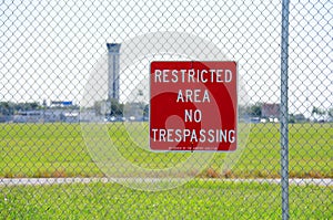 Restricted area no trespassing sign at airport