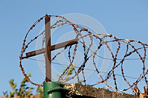 Restricted area. Passage is prohibited closed. Border from old barbed metal barrier wire. Concept of border, prison, war, military