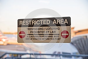 Restricted Area Sign On Airport Door photo