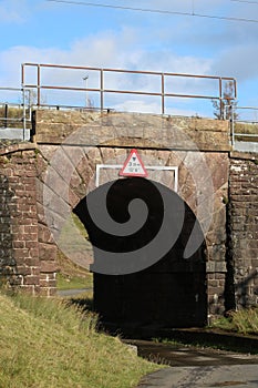 Restricted height road bridge under railway line