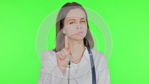 Restricting Female Doctor with Denying Gesture on Green Background