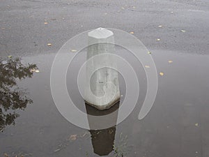 restrictive curbstone on the track flooded with water