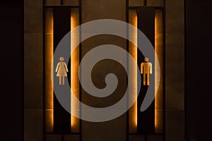 Restroom concept. Restroom sign on a toilet door. Female and male restroom sign. Restroom signs in public place