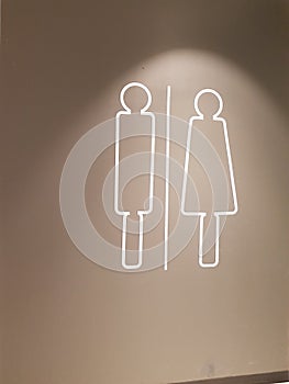 Restroom sign on a toilet door,on wall background.Toilet sign - Restroom Concept - .WC / Toilet icons set. Men and women