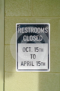 Restrooms Closed sign on a park`s public restroom