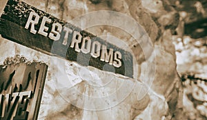 Restrooms sign with icy background