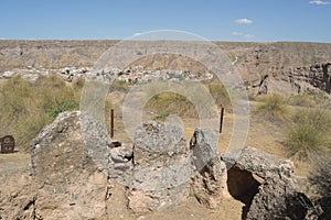 Rests of megalithic dolmen with Gorafe town at background, Granada, Spain