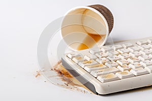 Result of eating in office, Coffee and damaged computer keyboard close up