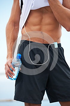The result of a powerful workout. Cropped image of a muscular and physically fit mans torso after exercise.